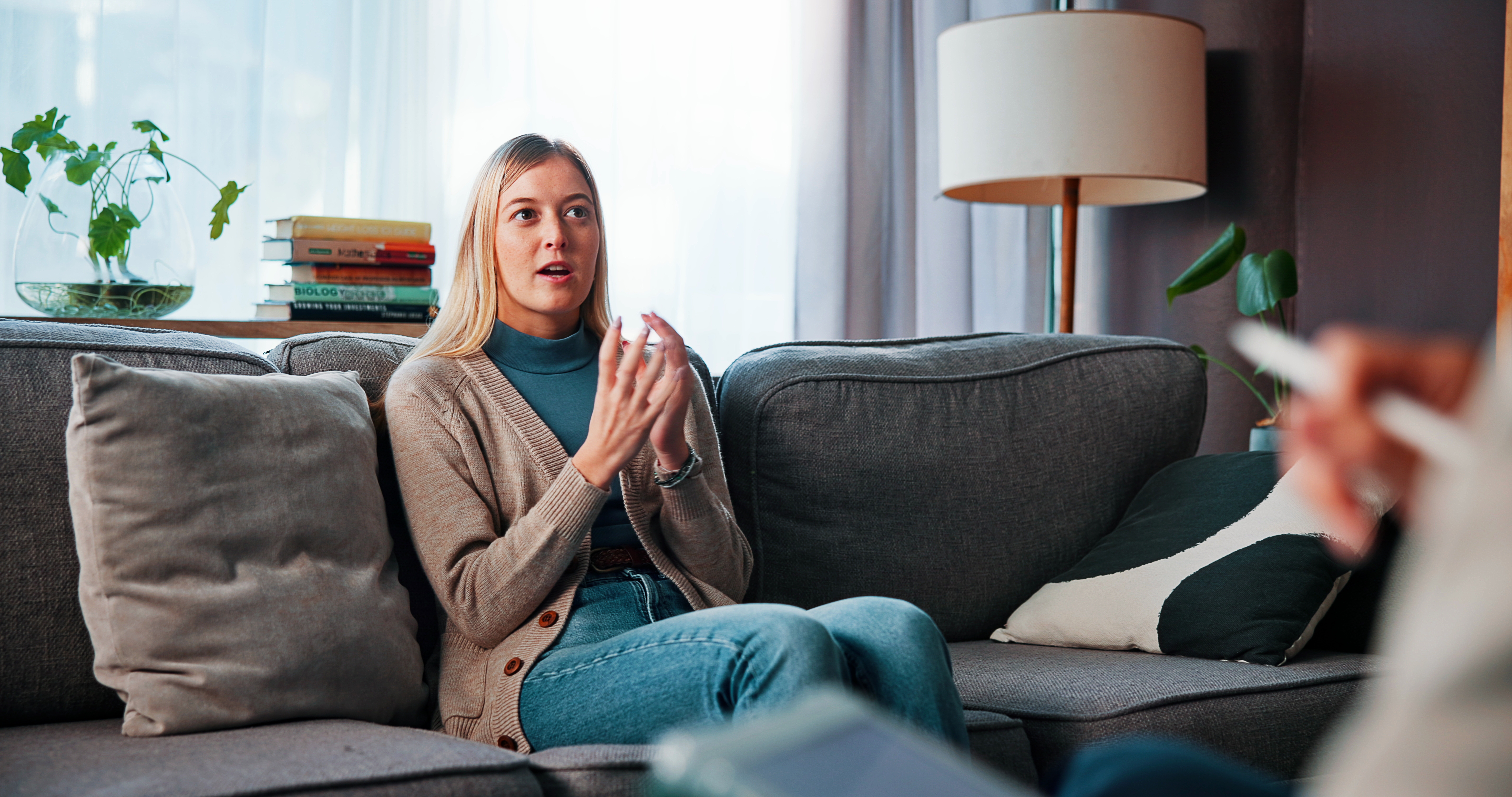 woman speaking in a therapy session.